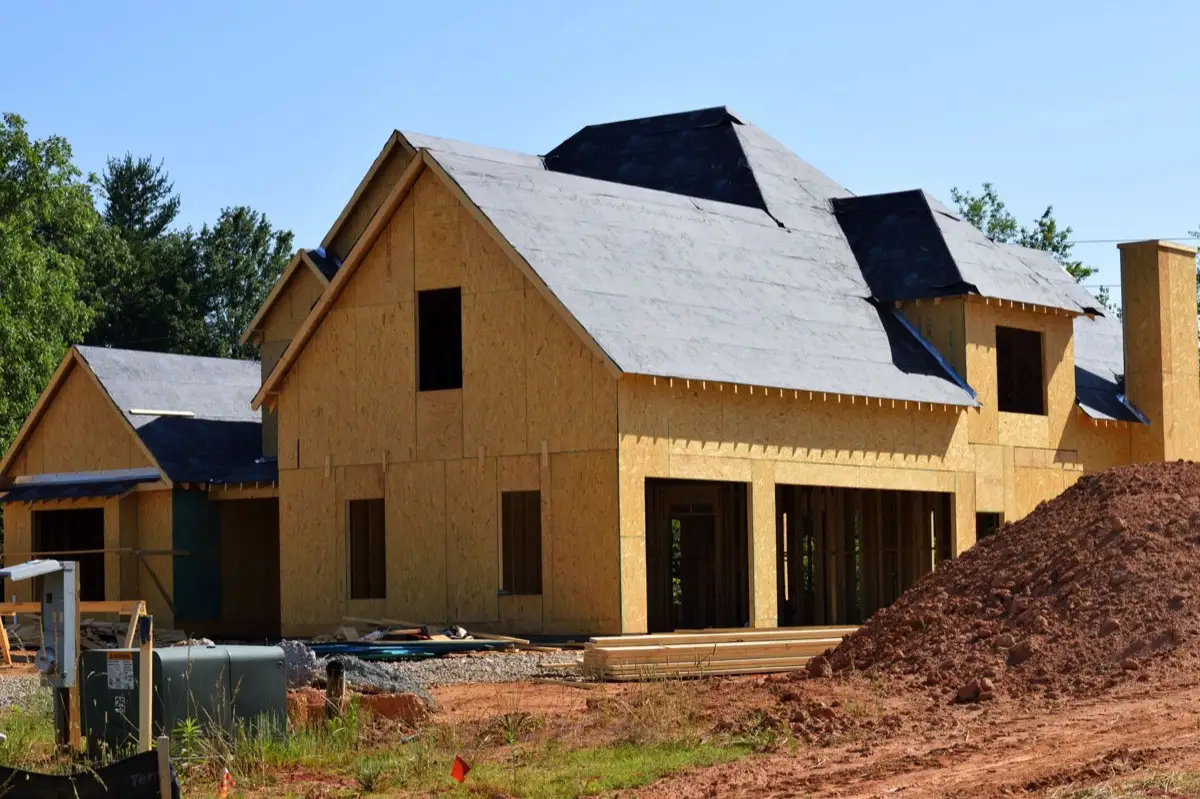 Underlayment rolled and capped on a bare roof deck in Warner Robins, GA